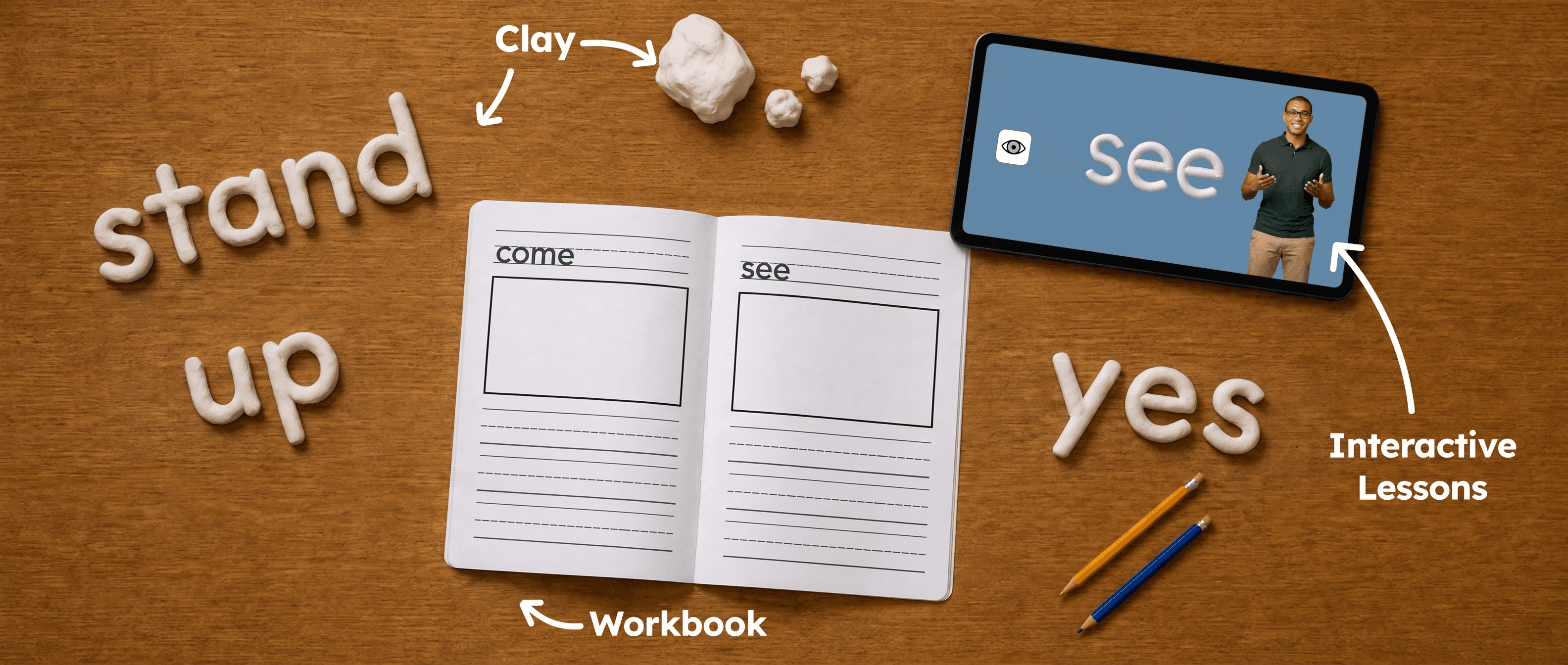 Clay sight words, a workbook, and a tablet lesson laid out on a desk