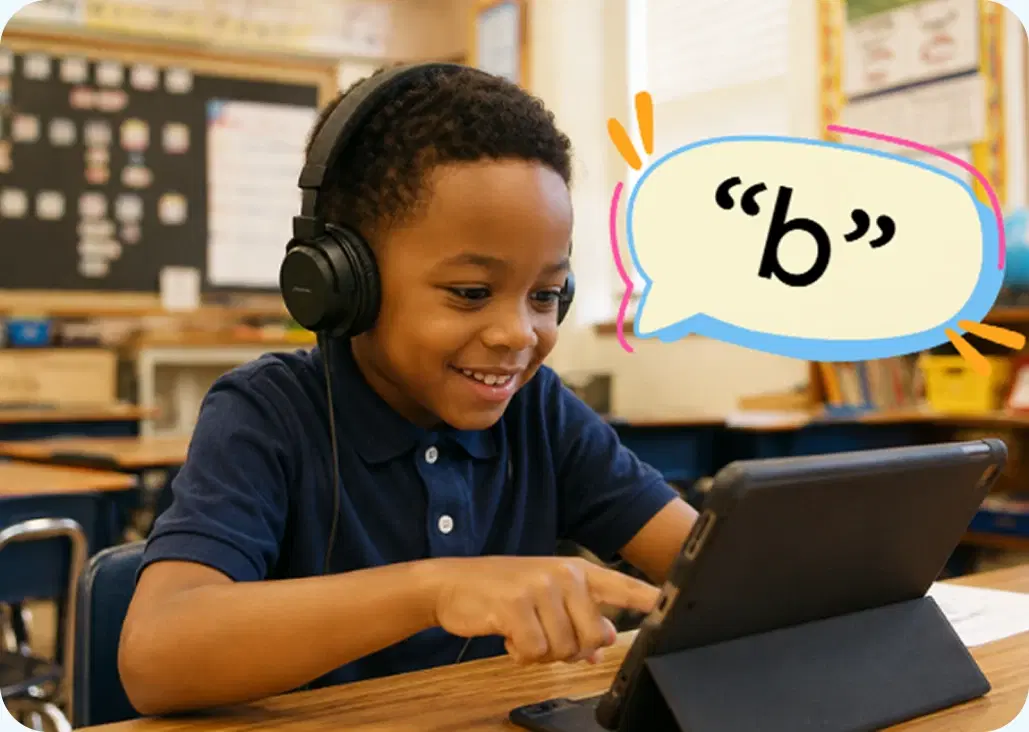 A child in headphones smiling at a tablet lesson that speaks the letter b