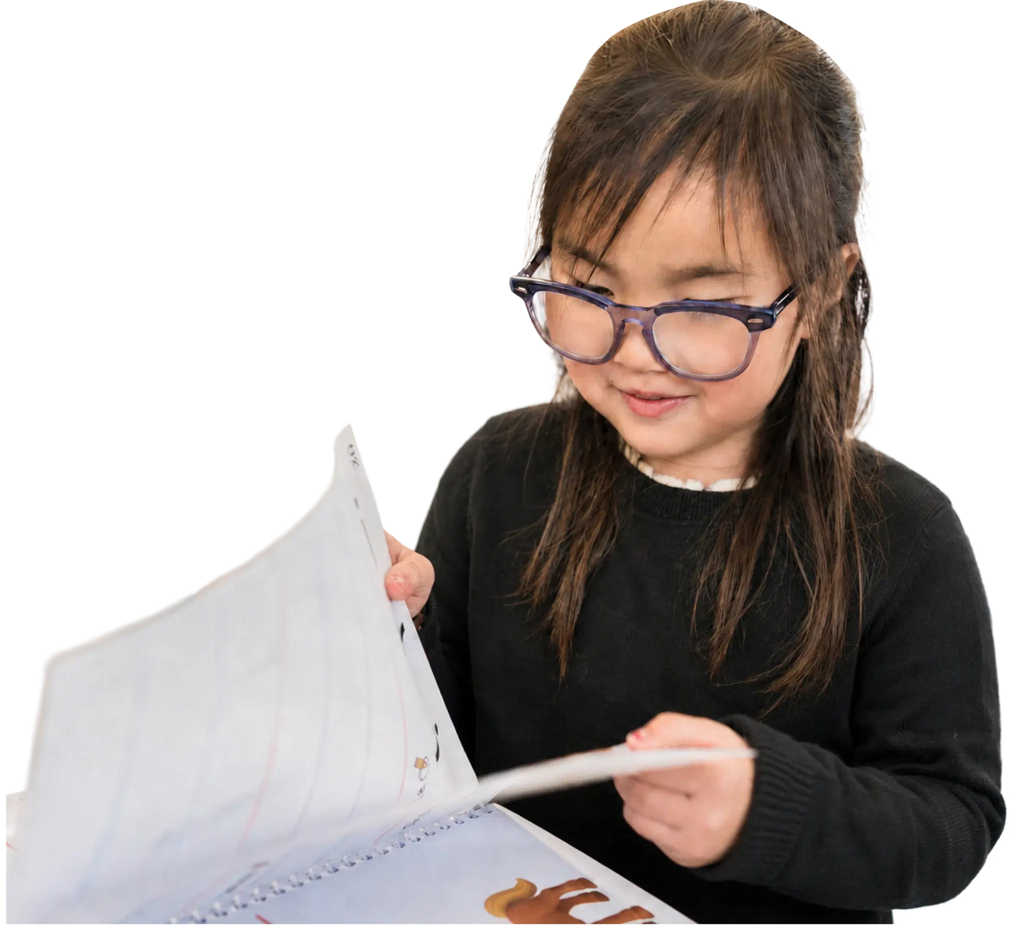 A child flipping through a workbook