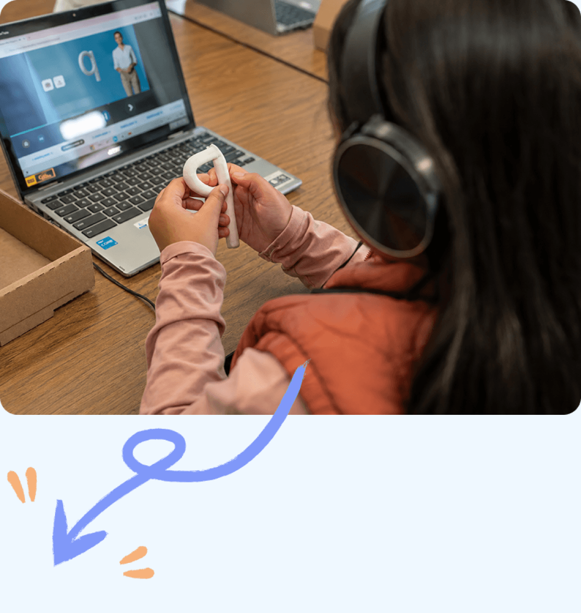 A child studying the clay letter q she built next to the same letter on her laptop
