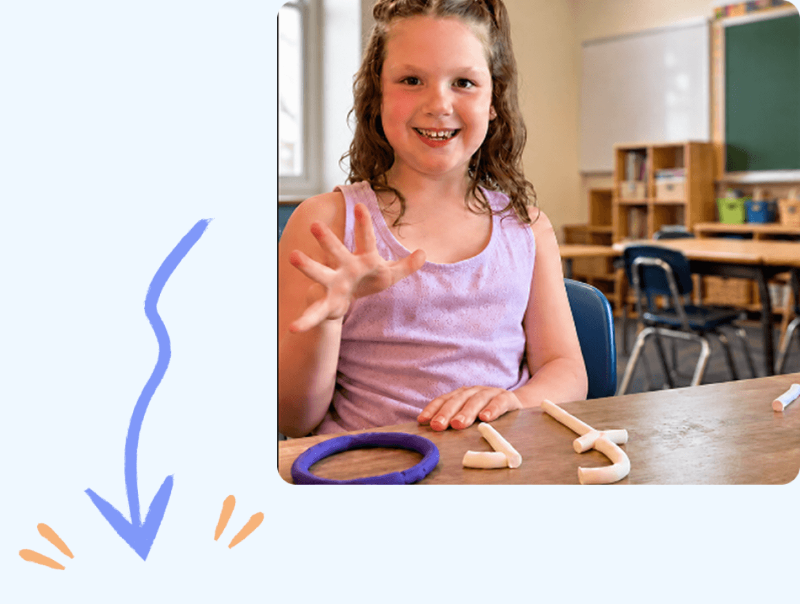 A student building a word with clay letters