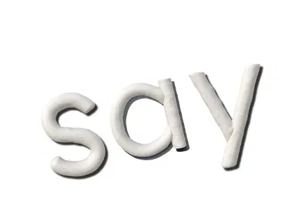 Clay letters spelling 'say'